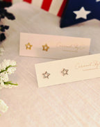 Gold and silver open star stud earrings on Caramel Sky Co jewelry cards, minimalist celestial jewelry for everyday wear.