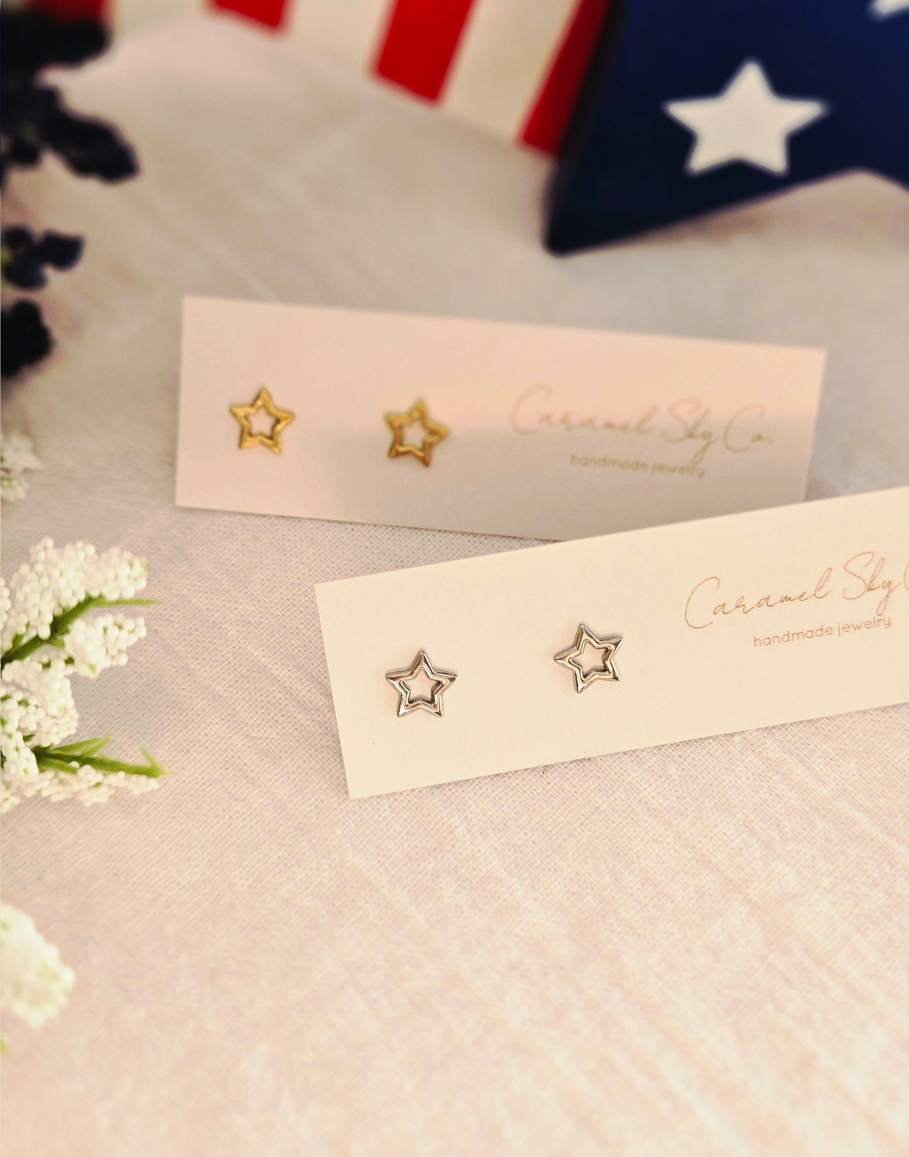 Gold and silver open star stud earrings on Caramel Sky Co jewelry cards, minimalist celestial jewelry for everyday wear.
