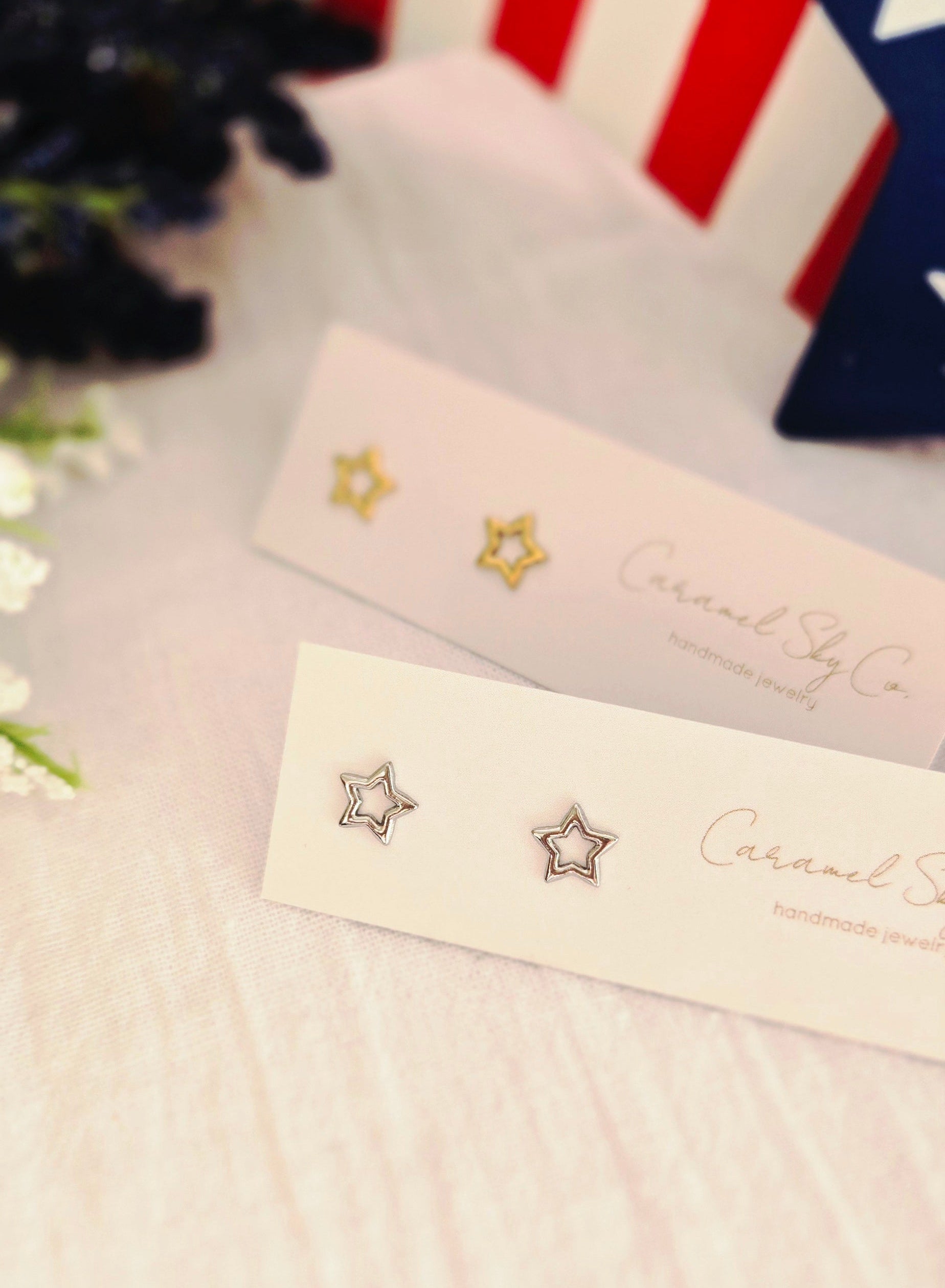 Gold and silver open star stud earrings on Caramel Sky Co jewelry cards, minimalist celestial jewelry for everyday wear.