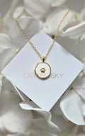 Gold and white enamel paw print pendant necklace, minimalist pet lover jewelry by Caramel Sky Co.