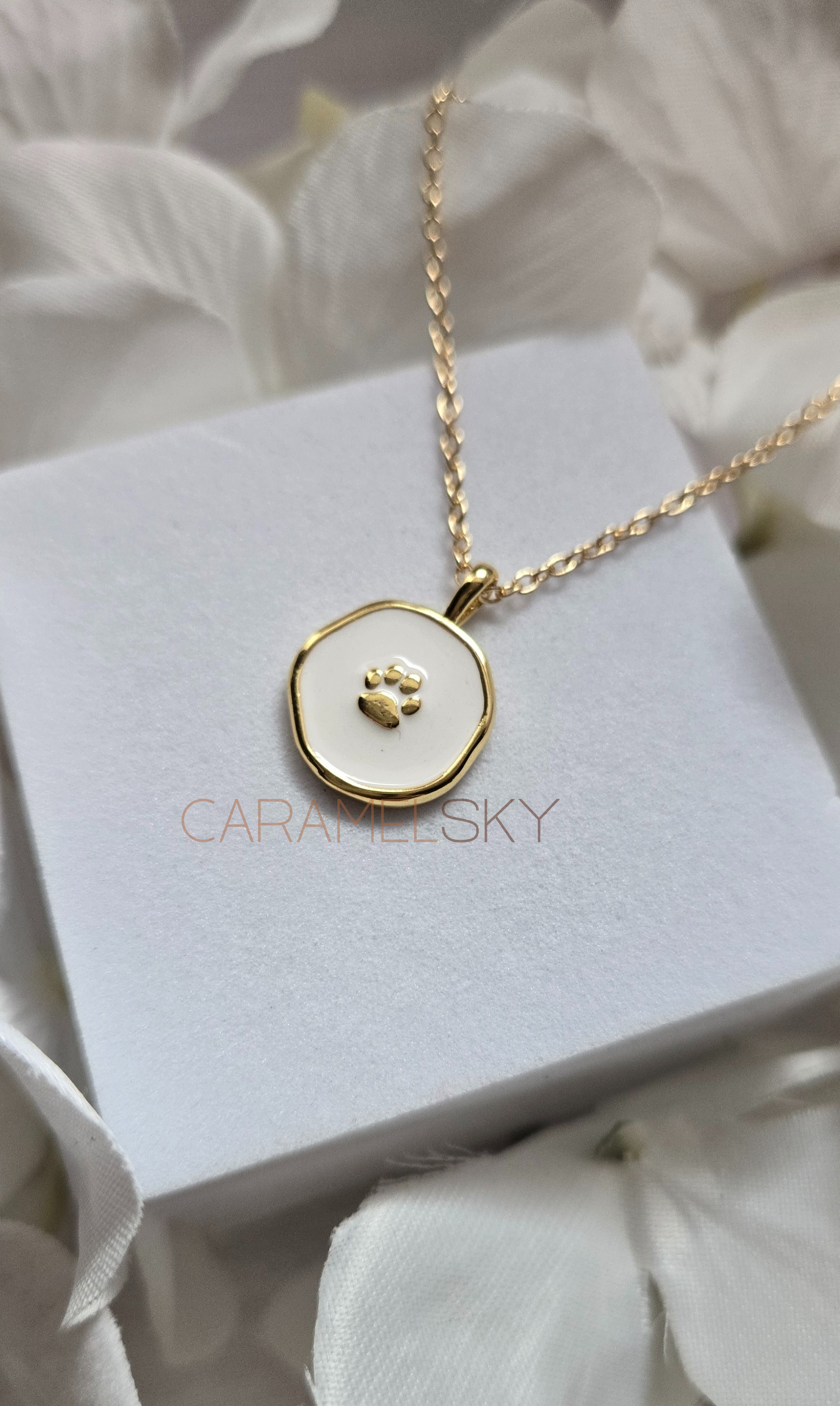 Gold and white enamel paw print pendant necklace, minimalist pet lover jewelry by Caramel Sky Co.